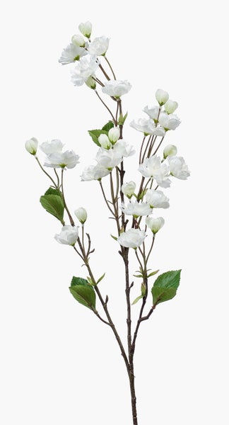 Künstlicher Kirschblütenzweig mit weißen Blüten und grünen Blättern.