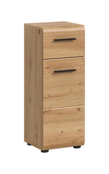 Badezimmer-Beistellschrank in Eichenoptik mit einer Schublade, einer Tür und schwarzen Griffen.