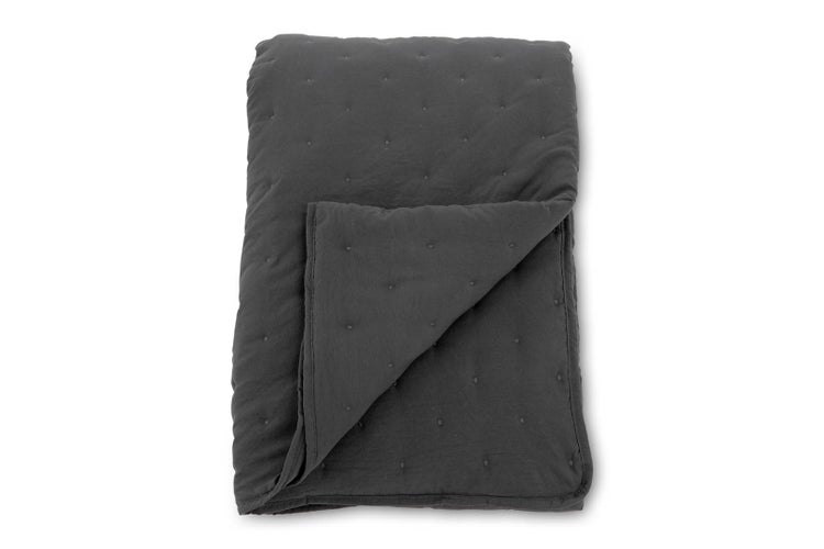 Dunkelgraue gesteppte Tagesdecke mit Punktmuster aus weichem Material für das Schlafzimmer.