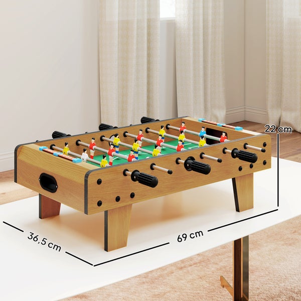 Tischkicker in Holzoptik mit Maßen von 69 Zentimeter Länge, 36,5 Zentimeter Breite und 22 Zentimeter Höhe.