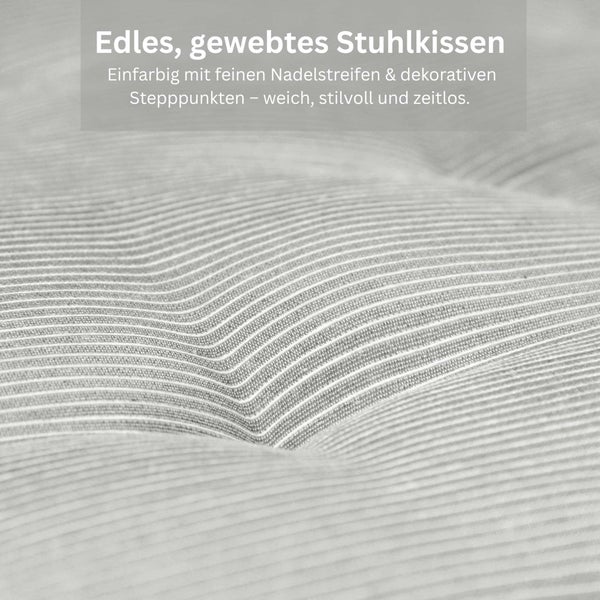 Gewebter Stoff eines Stuhlkissens mit feinen Nadelstreifen und einem Stepppunkt.