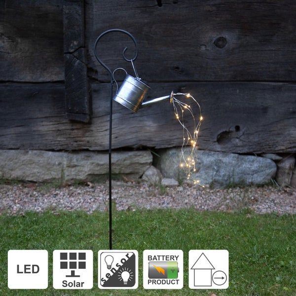 Weißer Adventsleuchter mit fünf Lichtern