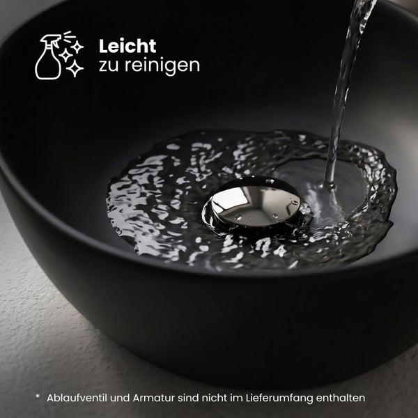 Schwarzes Waschbecken mit Wasserstrahl und Hinweis leicht zu reinigen. Ablaufventil und Armatur nicht im Lieferumfang enthalten.