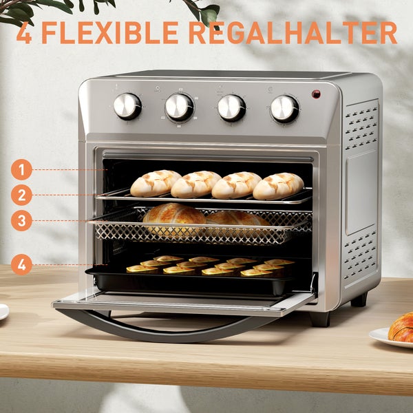 Silberner Mini-Backofen mit vier flexiblen Einschubebenen, gefüllt mit Backwaren auf verschiedenen Rosten und Blechen.