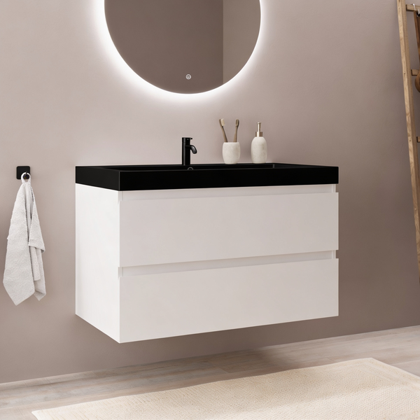 Moderner Waschplatz mit Waschtischunterschrank und beleuchtetem Rundspiegel in einem modernen Badezimmer.