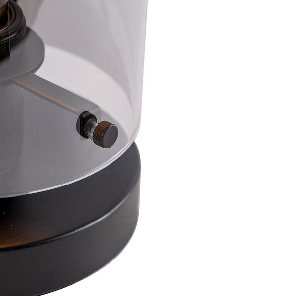 Detailaufnahme einer Leuchte mit durchsichtigem Lampenschirm und Drehknopf