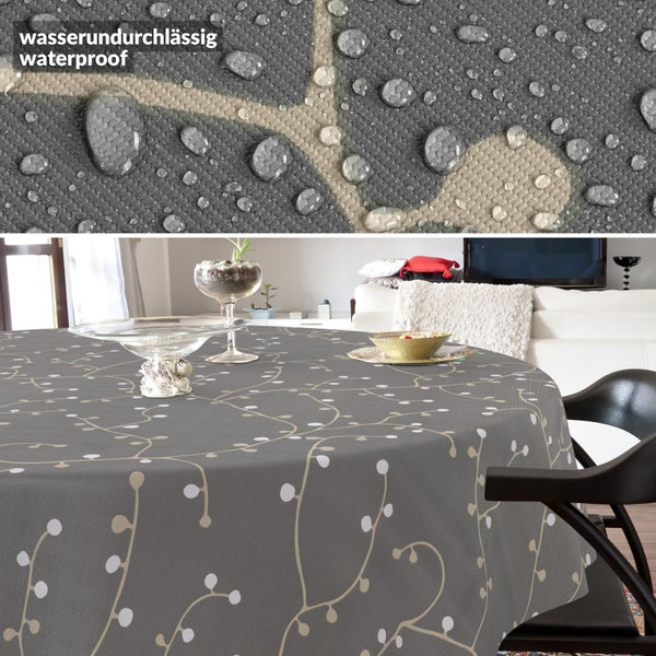 Runde Tischdecke mit Rankenmuster auf einem Tisch, inklusive Detailansicht der wasserundurchlässigen Oberfläche mit Wassertropfen.
