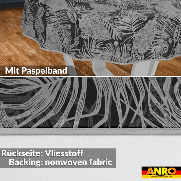 Rundes Tischtuch mit Palmenblatt-Muster, Paspelband am Rand und Vliesstoff-Rückseite. ANRO Deutsche Manufaktur Logo.