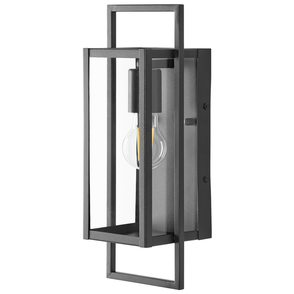 Rechteckige Außenwandleuchte in Laternenform aus Metall und Glas mit sichtbarem Leuchtmittel.