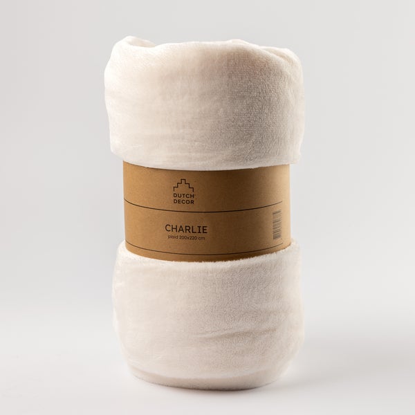 Gerollte Kuscheldecke mit Banderole