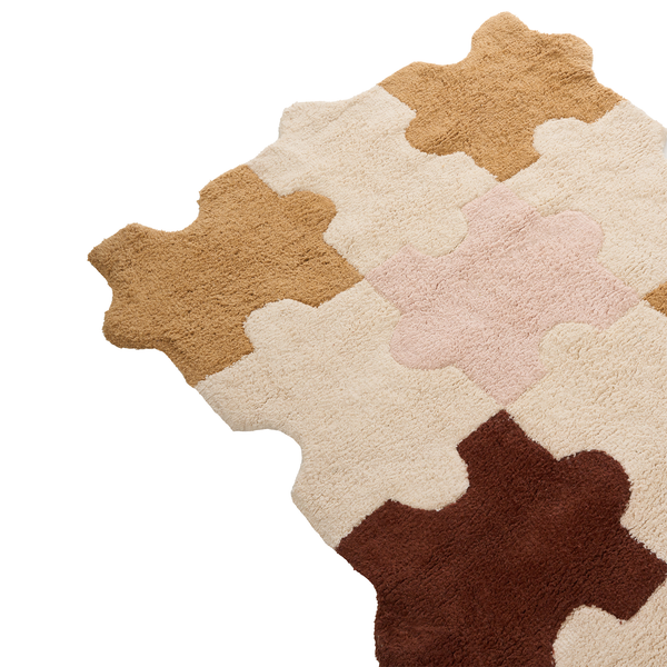 Teppich mit Puzzle Design in verschiedenen Farbtönen für den Wohnbereich