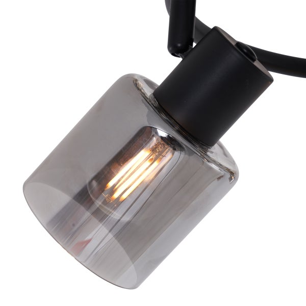 Detailaufnahme einer Lampe mit rauchglasfarbenem Lampenschirm und Glühbirne