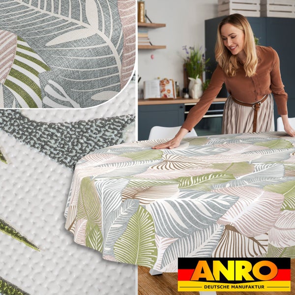 Abwaschbare runde Tischdecke mit Blattmuster in einer hellen Küche, Detailansicht der Oberflächenstruktur und ANRO Logo.