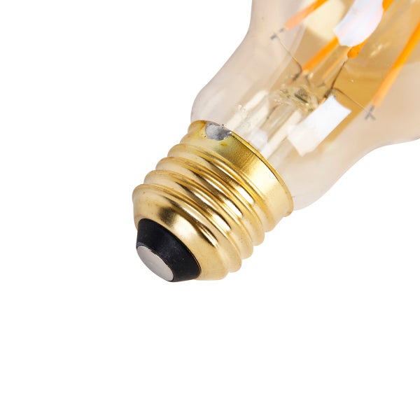 Nahaufnahme eines E27 Schraubsockels einer LED-Filamentlampe aus Glas.