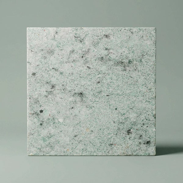Quadratische Fliese mit Terrazzo Optik aus Stein