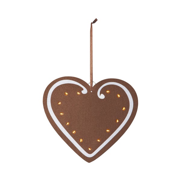 Dekoratives Herz mit Beleuchtung an einer Ziegelwand