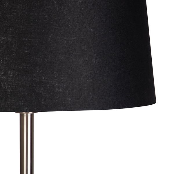 Detailaufnahme einer Lampe mit schwarzem Textilschirm und Metallelement.