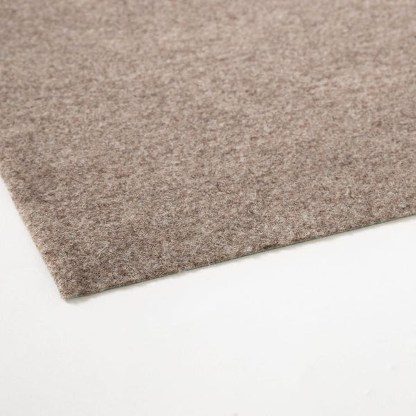 Nahaufnahme eines beigen Teppichbodens.