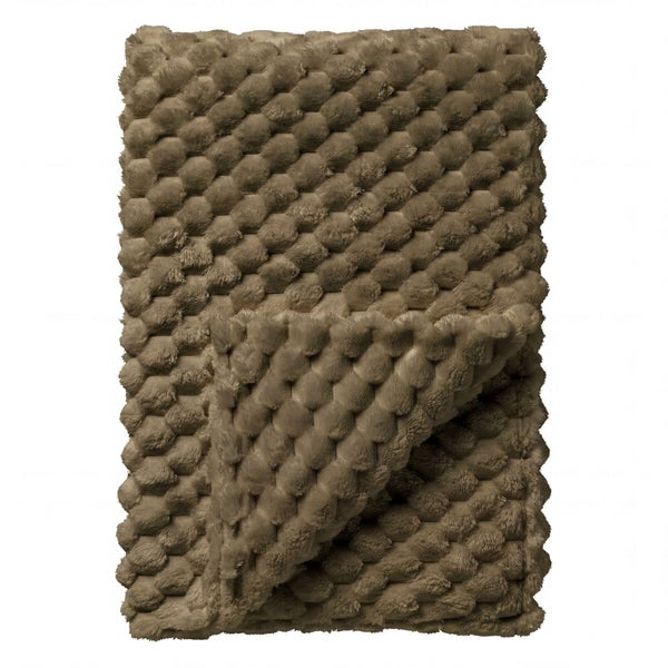 Braune Kuscheldecke mit strukturierter Noppenoberfläche.