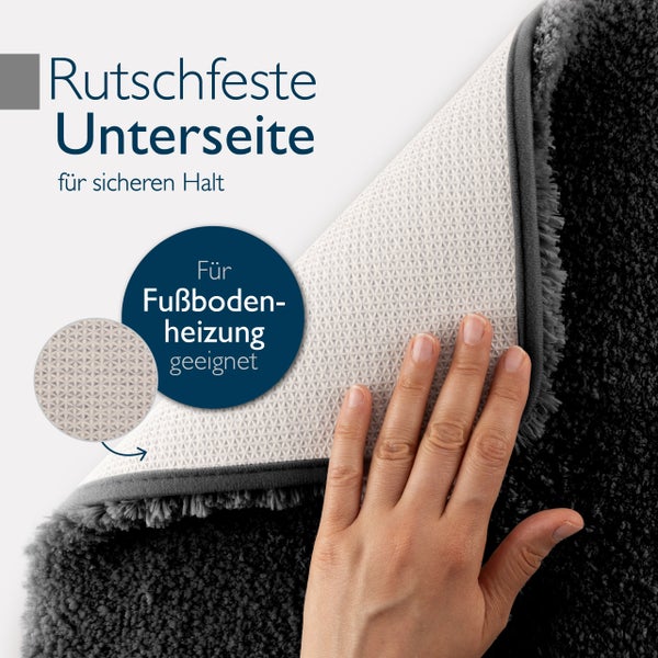 Rutschfeste Unterseite eines Teppichs, geeignet für Fußbodenheizung, mit einer Hand berührt