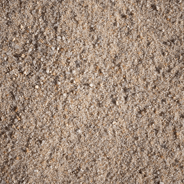 Strukturaufnahme von feinem Sand mit unterschiedlichen Körnungen und Kieselsteinen als Schüttgut