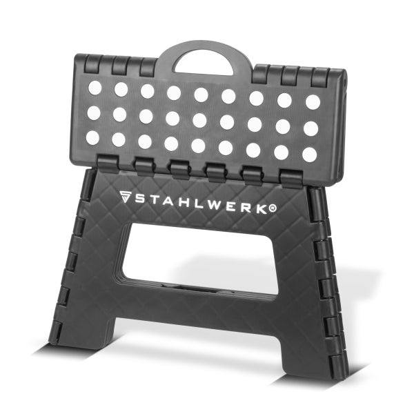 Klappbarer Trittschemel aus schwarzem Kunststoff von Stahlwerk mit Tragegriff und rutschfester Oberfläche.