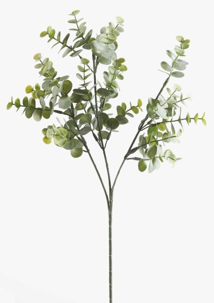 Künstliche Graspflanze im Topf mit langen schmalen Blättern.