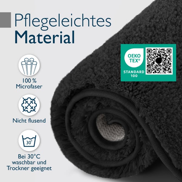 Gerollte Badematte aus pflegeleichter Mikrofaser mit Oeko Tex Standard 100 Zertifizierung, fusselfrei und waschbar bei 30 Grad Celsius.