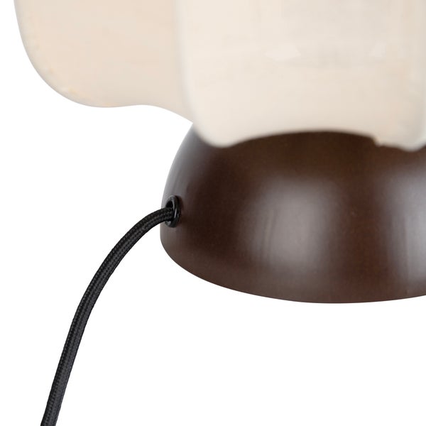 Nahaufnahme eines braunen Lampenfußes mit einem schwarzen Textilkabel.