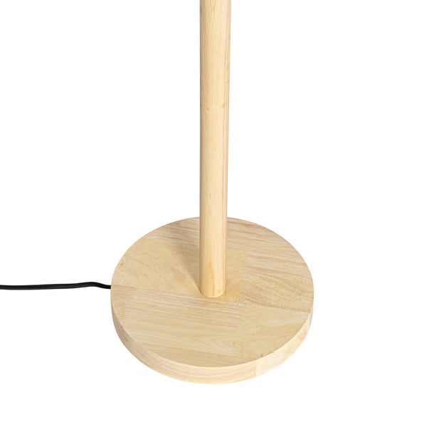 Runder Lampenfuß aus hellem Holz mit aufrechtem Ständer und Stromkabel.