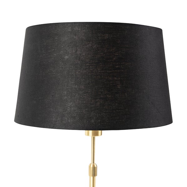 Schwarzer Lampenschirm auf goldenem Lampenfuß