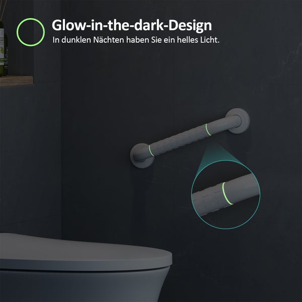 Wandmontierter Haltegriff für das Badezimmer mit im Dunkeln leuchtenden Markierungen und strukturierter Grifffläche neben einer Toilette.