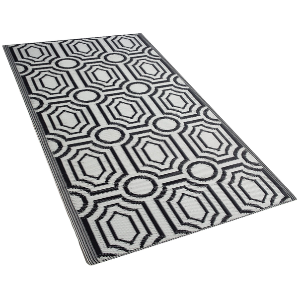 Rechteckiger Outdoor-Teppich mit geometrischem Muster aus Oktogonen und Kreisen.