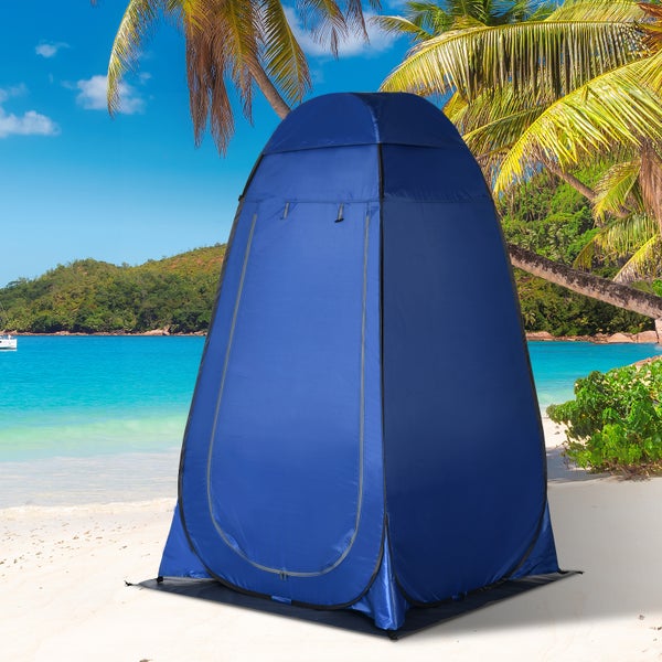 Blaues Pop-up-Umkleidezelt an einem tropischen Strand mit Palmen und türkisfarbenem Wasser.