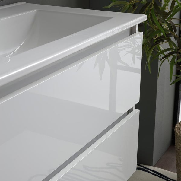 Detailaufnahme eines weißen Waschtischunterschranks mit zwei Schubladen und einem Waschbecken