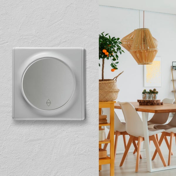 Runder Rollladenschalter zur Wandmontage in einem modern eingerichteten Esszimmer.