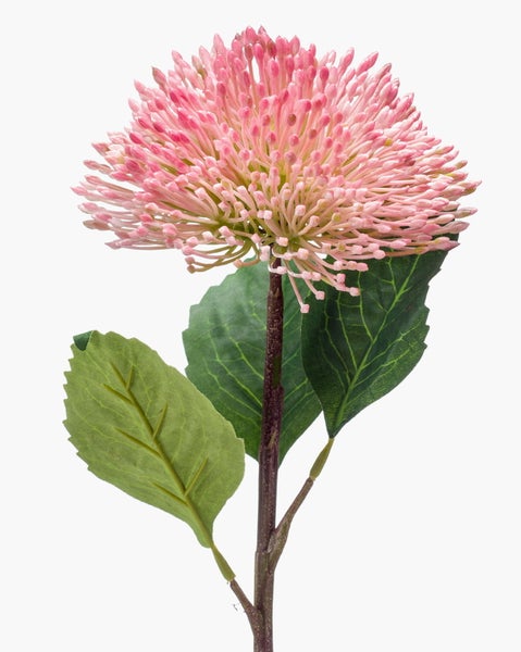 Künstlicher Blumenzweig mit rosa Blüte und grünen Blättern