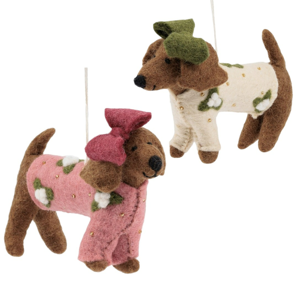 Zwei Hundeornamente mit Schleifen und Blumenmotiven