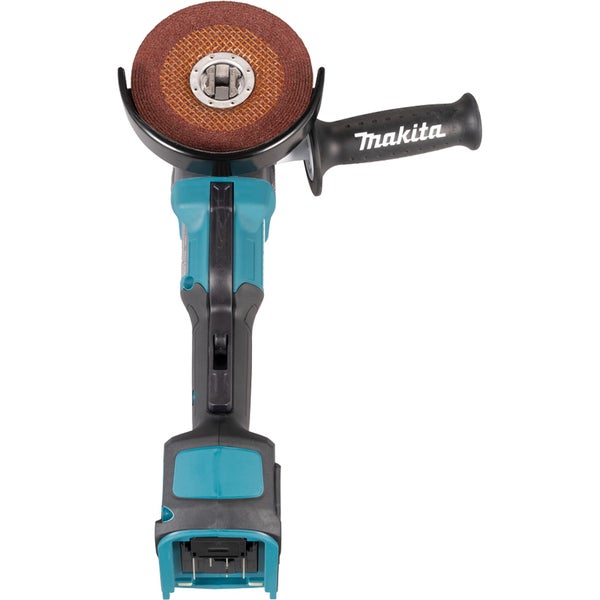 Makita Akku-Winkelschleifer in Türkis und Schwarz mit Seitengriff und montierter brauner Trennscheibe in der Draufsicht.