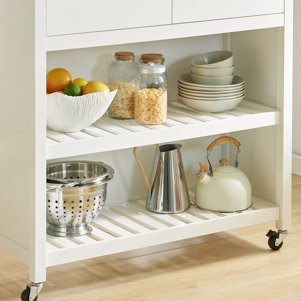 Küchenwagen mit Geschirr, Obst und Küchenutensilien auf zwei Ablageflächen