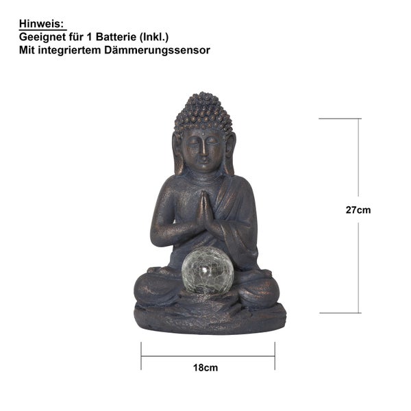 Dekoratives Arrangement mit zwei Adventsleuchtern, Hyazinthe und Mandeln auf einem Tisch