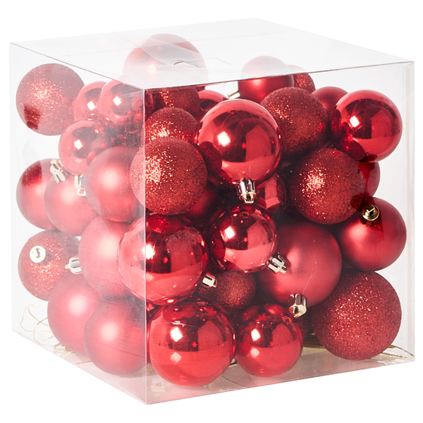 Drei rote Weihnachtskugeln mit unterschiedlichen Oberflächen