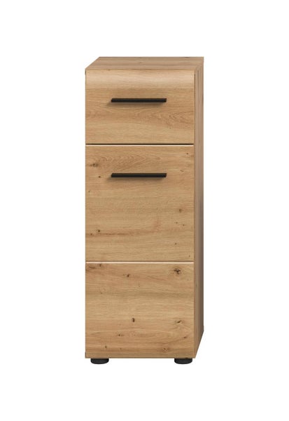 Badezimmer-Beistellschrank in Eiche-Optik mit einer Schublade, einer Tür und schwarzen Griffen.