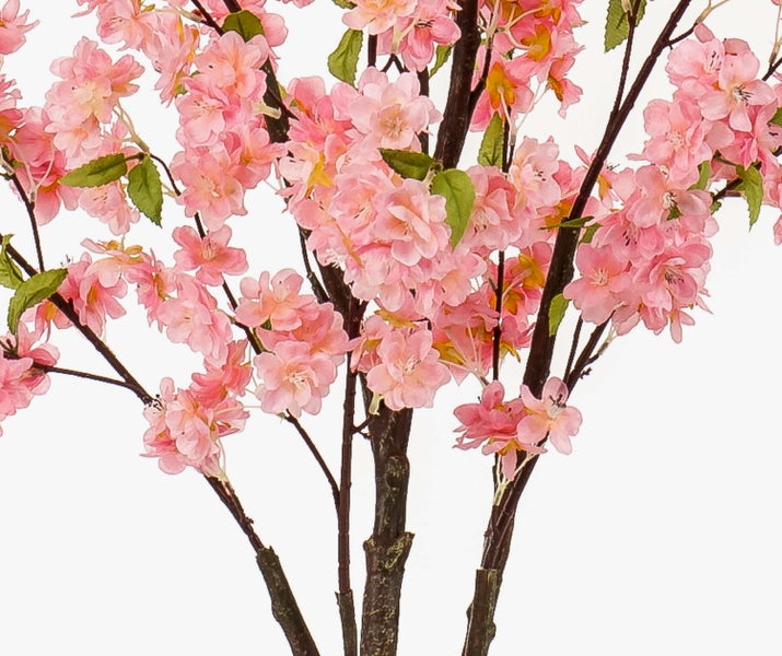 Künstliche Kirschblüte mit rosa Blüten, grünen Blättern und braunen Ästen