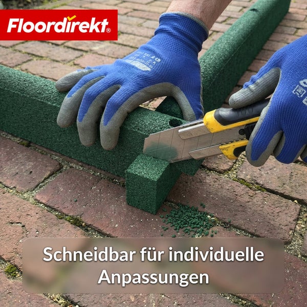 Bordsteinbefestigung aus Gummi wird mit einem Cuttermesser zugeschnitten