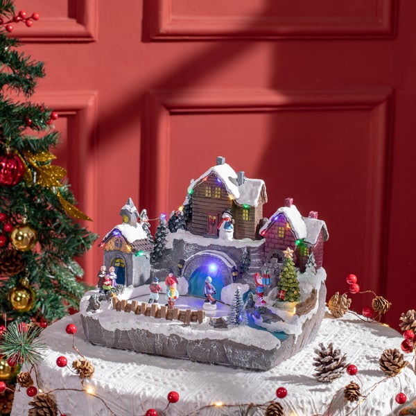 HOMCOM Weihnachtsdorf Tischdeko mit LED-Leuchtung Weihnachtsdeko Schlittschuhbahn Motiv mit beweglichen Kinder Weihnachten Village Winterlandschaft 32 x 25,5 x 24 cm