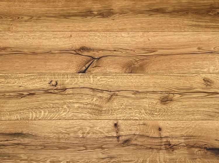 Rustikale Holzdielen aus Eiche mit markanter Maserung und Astlöchern.