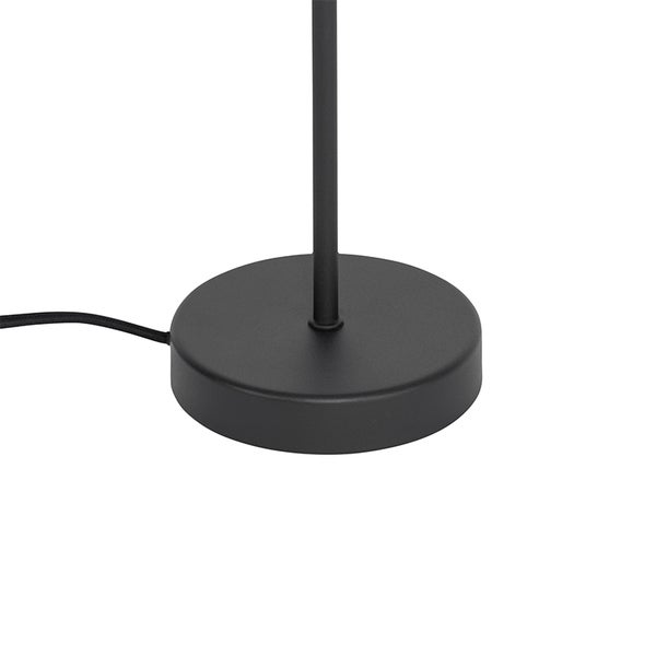 Runder, schwarzer Lampenfuß aus Metall mit Kabel.