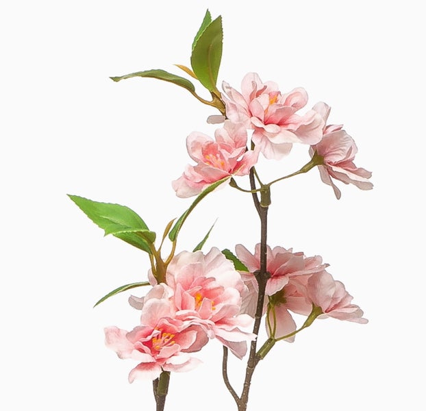 Künstlicher Blütenzweig mit rosa Blüten und grünen Blättern.