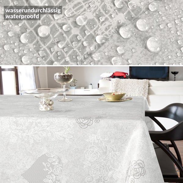 Wasserundurchlässige Tischdecke mit Blumenmuster auf gedecktem Tisch